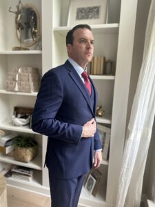 Rob Edward's three-piece Barcelino Suit and Red Tie