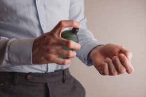 Spraying Cologne On Wrists