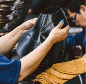 Shoemaker Cutting Leather